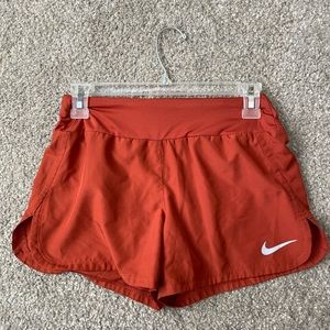 Women’s Nike XS burnt orange running shorts